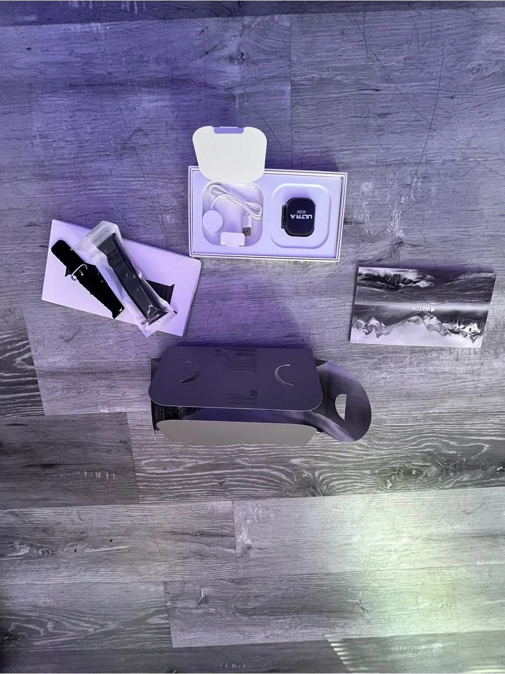Apple Smartwatch with Black Sport Band and White Charging Dock